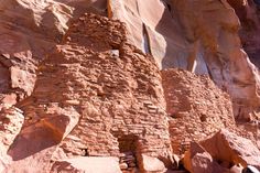 an old building in the middle of some rocks