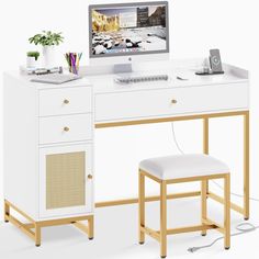 a white desk with a computer monitor, keyboard and two stools next to it