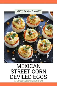 mexican street corn deviled eggs on a black plate with text overlay that reads spicy, tangy, savory