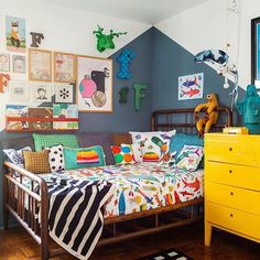 a child's bedroom decorated in bright colors