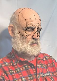 an old man with a bald head and glasses