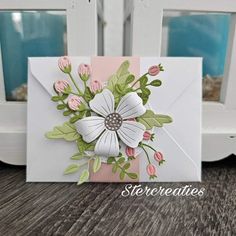 a close up of a card with flowers on it