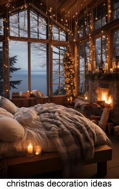 a bedroom decorated for christmas with lights on the windows and a bed in front of a fireplace