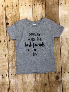 "\"Cousins make the best friends\" Cousins are our first best friends. This shirt makes an adorable matching set for cousins to wear or even to wear independently to show cousin love. You can customize them with names or leave them blank! DETAILS OF YOUR ORDER Colors shown in the listing images are heather grey shirt/bodysuit with black vinyl. You will receive these exact colors unless otherwise discussed via Etsy messenger prior to purchase. Pricing shown is PER bodysuit/shirt. You will need to Cute Tops With Funny Text For Family Events, Cute Tops With Funny Text For Family, Funny Personalized Cotton Tops, Playful Personalized Cotton Tops, Best Friends Shirts, Friends Shirts, Cousin Love, Bodysuit Shirt, Superhero Capes