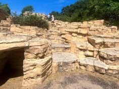 some people are standing on top of rocks