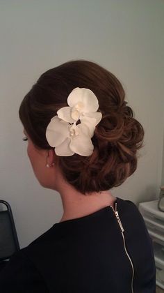 a woman with a flower in her hair