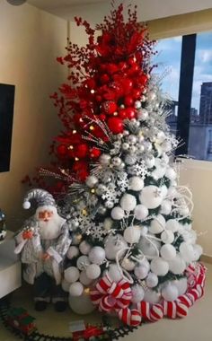 a christmas tree decorated with white and red ornaments