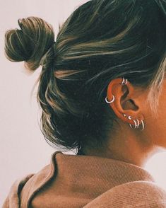 a woman with ear piercings on her ears