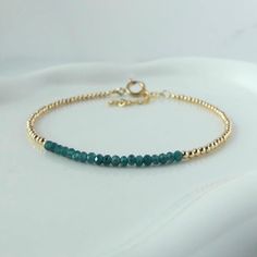 Introducing this stunning, extra dainty and extremely rare teal grandidierite  bracelet, featuring delicate, skinny minimalist design.  This  2.5mm gemstone beaded bracelet will make  it an ideal meaningful jewelry gift for a mother, friend, girlfriend, daughter, sister, teacher, wife, bride, bridesmaid, or yourself. It is perfect for stacking or layering all year around. It is timeless and classy and made to last. It will come in a gift-ready pouch. Perfect engagement, wedding, birthday, or ann Elegant Turquoise Birthstone Bracelets, Elegant Everyday Turquoise Beaded Bracelet, Christmas Bracelet, Meaningful Jewelry, Chain Extenders, Gemstone Beaded Bracelets, Christmas Mom, Green Crystals, Sterling Silver Bead