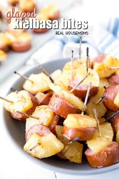 a bowl filled with potatoes and toothpicks on top of a table