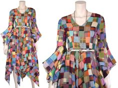 "This 70s-era fairycore dress features an incredible cotton patchwork, asymmetric bell sleeves, and asymmetric knee-length hem. Each patchwork piece is individually squared and then the squares are pieced together. Very unique. Dress is unlined and zips up the back with a metal zipper. Best fits size xs or small (please check measurements below). Accessories not included.  Approximate Flat Measurements:  Multiply times 2 for bust, waist, and hip measurements. For best fit, compare with a similar Cheap Patchwork Dresses For Work, Luxury Lace Patchwork Dresses For Fall, Cheap Button-up Patchwork Dresses, Cheap Patchwork Dresses For Fall, Luxury Patchwork Dresses For Women, Cheap Multicolor Patchwork Dress, Cheap Blue Patchwork Dresses, Luxury Long Sleeve Patchwork Dresses, Cheap Multicolor Patchwork Maxi Dress