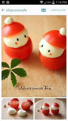 there are two small red and white balls with faces on them, one in the shape of a tomato