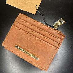 Keep Your Essentials Organized In Style With This Steve Madden Bhayden Card Holder Wallet. This Sleek And Compact Wallet Features Multiple Card Slots, A Zippered Compartment For Coins, And An Id Window. The Cognac Color And Gold-Tone Hardware Add A Touch Of Elegance, Making It Perfect For Everyday Use Or As A Gift. Multiple Card Slots Zippered Coin Compartment Id Window Gold-Tone Hardware With Steve Madden Logo Steve Madden Card Holder, Steve Madden Wallet, Denim Wallet, Silver Wallet, Cognac Color, Compact Wallet, Steve Madden Bags, Leather Card Case, Phone Purse