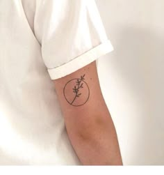 a person with a small tattoo on their arm