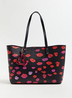 This stylish tote bag features an allover lip print, top handles, and a key tag. We made the arm strap a little longer for maximum comfort.   A bold, limited-edition collection that combines the pretty-meets-punk aesthetic of Betsey Johnson with Torrid’s. 14. 5” L x 5” W x 11” H. 11” top handle. Magnetic closure. Man-made materials. Imported. The best plus size women's betsey johnson black lips tote bag with heart tag handbags in multi. Torrid is your destination for the freshest spring and Knit Skater Dress, Lip Print, Punk Aesthetic, Betsey Johnson Handbags, Stylish Tote Bag, Black Lips, Heart Tag, Lips Print, Betsy Johnson