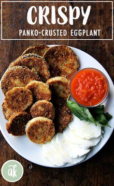 crispy panko - crusted eggplant on a plate with tomato sauce