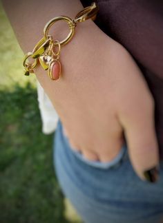 This sterling  silver and gold plated coral bracelet is handmade and unique. Because of this, there may be small difference in each piece. I used  sterling silver (925K)  with silver smithing technique and I made gold plated. This charming bracelet can be a great alternative for yourself or a gift idea in the summer time. Silver heart and coral gemstone are attached to the clasp. if you want you can separate it from the clasp and use it separately. This silver chain bracelet is suitable for dail Gold Charm Bracelet With Natural Stones Gift, Yellow Gold Metal Bracelets With Heart Charm, Gold Bangle Charm Bracelet With Heart Charm, Adjustable Gold Plated Bracelet With Heart Charm, Brass Bracelet With Charms, Brass Charm Bracelet Jewelry, Heart Charm Bangle Bracelet For Everyday Wear, Gold Charm Bangle Bracelet Gift, Yellow Gold Brass Charm Bracelet Gift