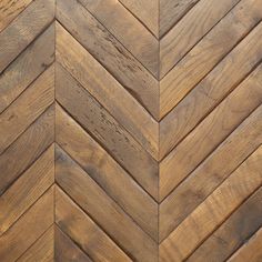 an image of wood flooring that looks like herringbones or chevron boards