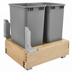 two gray bins sitting on top of a wooden stand