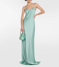 Look to Max Mara for understated elegance such as the Selce maxi dress. Made from lustrous satin in a turquoise hue, the slip design hangs by slim straps and fastens with an invisible zipper at the back..Made in Italy.Material: 29% viscose, 71% acetate.Closure: zipped back, buttoned back.Lining: 10% silk, 85% acetate, 5% polyamide.Care instructions: dry clean.True to size.Cinched waist.Mid-weight material.DT = German size.The model seen in the picture is 178cm-5'10' and wearing a size DT 34 Full-length Satin Slip Dress, Full Length Satin Slip Dress, Solid Satin Maxi Dress For Summer, Full-length Satin Slip Dress For Evening, Full Length Satin Slip Dress For Evening, Green Bias-cut Maxi Length Slip Dress, Green Bias Cut Maxi Length Slip Dress, Green Bias Cut Slip Dress For Evening, Solid Satin Slip Dress For Evening