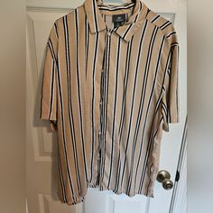 Tan With Stripes. Large Hm Button Down Short Sleeve Shirt. Large. Never Worn. Excellent Condition H&m Relaxed Fit Shirt With Button Closure, H&m Relaxed Fit Shirt With Buttons, H&m Relaxed Fit Collared Shirt, Striped Collared Short Sleeve Shirt With Button Closure, Casual Beige Button-up Short Sleeve Shirt, H&m Casual Collared Shirt, H&m Tops With Buttons And Relaxed Fit, H&m Button-up Shirt For Summer, H&m Collared Shirt With Button Closure