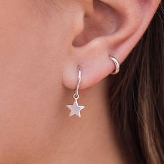 These Earrings are Sterling Silver Hoops with a hanging star. They are earrings that feel great for day to day or for a special occasion. They are modern and minimalist in style and you can wear them both on the earlobe and on the cartilage. You can buy the earrings in sterling silver or silver with a gold plating. Features: 925 sterling silver silver or gold plated Diameter: 11mm nickel free. If you have any questions, do not hesitate to contact us, we will be happy to assist you! Hanging Star Earrings, Small Silver Hoop Earrings, Dagger Earrings, Silver Star Earrings, Gothic Earrings, Girly Jewelry, Gothic Jewelry, Sterling Silver Hoops, Jewelry Earrings Hoops