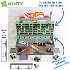 toy cars are parked in front of a building with numbers on the side and measurements for each vehicle