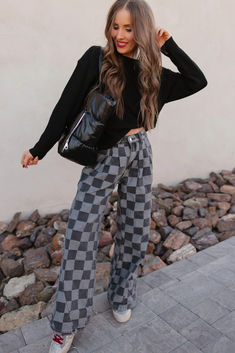 Step up your denim game with these Hot to Go Checked Denim wide-leg jeans! Featuring a bold, eye-catching pattern, these jeans bring an unexpected twist to a classic silhouette. The wide-leg cut offers comfort and effortless movement, while the unique dark grey checkered print adds a touch of urban sophistication. Checkered Jeans, Pocket Sweater, Checkered Print, Athleisure Wear, Halloween Fashion, Round Neck Tops, Short Sleeved Sweaters, Wide Leg Denim, Denim Outfit