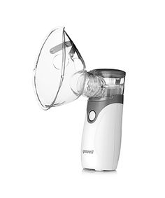 a white blender sitting on top of a white table next to a glass cup