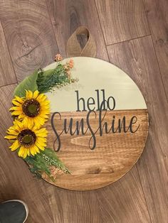 a wooden sign that says hello sunshine with sunflowers