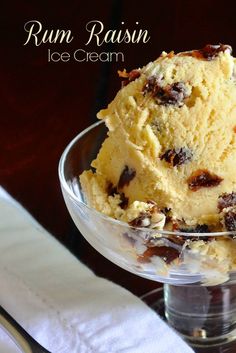 a glass bowl filled with ice cream on top of a table