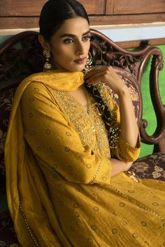 Yellow anarkali with hand embroidered yoke. Comes with churidar and crushed silk dupatta.
Component: 3
Pattern: Embroidered
Type Of Work: Floral Motifs
Neckline: V-Neck
Sleeve Type: Three Quarter
Fabric: Anarkali: Tissue Chanderi, Churidar: Lycra Net, Dupatta: Silk
Color: Yellow
Other Details: 
Floral motif embroidery
Cutwork hem lace
Note: The outfit worn by the model on the back is not for sale
Occasion: Mehendi and Haldi - Aza Fashions Chanderi Anarkali Set With Resham Embroidery, Anarkali Kurta With Resham Embroidery In Chinon, Unstitched Chinon Anarkali Set For Designer Wear, Anarkali Mulmul Sets For Designer Wear, Designer Wear Straight Kurta In Chinon, Anarkali Jamawar Set With Zari Work, Designer Chanderi Kurta With Dabka Work, Eid Anarkali Set With Zari Work In Jamawar, Designer Chinon Anarkali Set With Straight Kurta