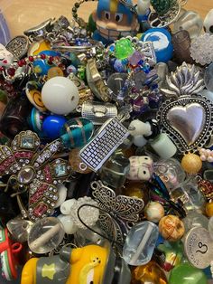 a pile of assorted jewelry sitting on top of a table