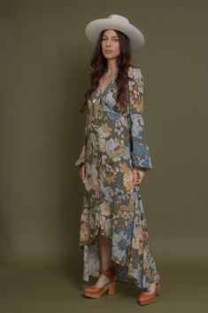 Brand: Promesa Long sleeve button front floral maxi dress with a high low hem. ♡ Details Color: Smoke Green Working button front High low hem Partially lined 100% Rayon Hand wash recommended Size & Fit Model Info: Height 5'3"| Bust 32"| Waist 25"| Hips 34" Model is wearing a size small Fit: Relaxed fit Stretch: No stretch Measurements: S: Bust 35" | Length 54" M: Bust 37" | Length 55" L: Bust 39" | Length 55" Floral Print Long Maxi Dress For Fall, Flowy Spring Maxi Dress With Button Closure, Spring Floral Print Maxi Dress With Asymmetrical Hem, Floral Print Button-up Midi Dress For Vacation, Spring Long Midi Dress With Button Closure, Floral Print Maxi Dress For Fall, Spring Midi Dress With Button Closure, Beach Dress With Floral Print And High-low Hem, Fitted Floral Print Button-up Maxi Dress