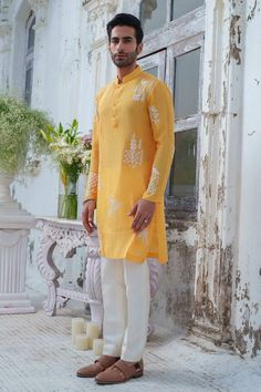 Yellow full sleeves kurta with royal peacock beaded embroidery. Paired with an ivory trouser. - Aza Fashions Yellow Bandhgala With Chikankari Embroidery, Yellow Long Sleeve Bandhgala With Chikankari Embroidery, Yellow Bandhgala With Resham Embroidery Long Sleeve, Navratri Bandhgala With Long Sleeves And Dabka Work, Yellow Long Sleeve Bandhgala With Resham Embroidery, Designer Bollywood Unstitched Suit With Long Sleeves, Yellow Unstitched Suit With Intricate Embroidery, Long Sleeve Lawn Suit With Chikankari Embroidery, Bollywood Designer Wear Unstitched Suit