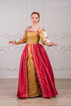 ONLY TO ORDER 3-4 weeks Beautiful and bright Renaissance dress will looks good at any medieval fair, historical festival, carnivale or renaissance ball. It will create the uniqueness of your character for sure. This Medieval dress made from decorative fabric gold color: bodice, sleeves and under skirt; and bright red taffetta - top skirt. Robe renaissance decorated with red ribbon and gold cord around the neck adorned with gold and red stones different sizes. As renaissance style we used decorat Pink Medieval Dress, Dress Medieval, Wine Colored Dresses, Lucrezia Borgia, Vintage Attire, Medieval Gown, Gown Gold, Italian Dress, Medieval Dress