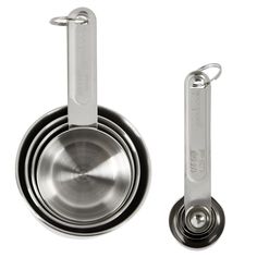 three stainless steel measuring cups and spoons with one holding a metal clip on the side