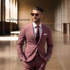 a man in a suit and sunglasses walking down a hallway with his hands on his hips