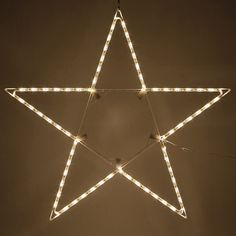 a lighted star hanging from the ceiling