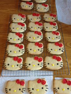 hello kitty cookies are on a cooling rack and ready to be baked in the oven