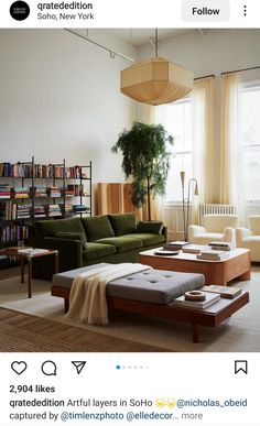 a living room filled with furniture and bookshelves