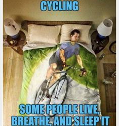 a man riding a bike on top of a bed with the words cycling some people live breathe and sleep it