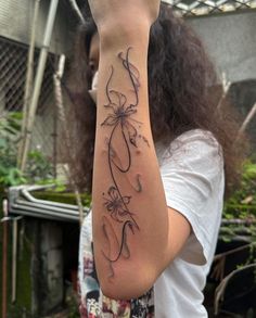 a woman with a tattoo on her arm