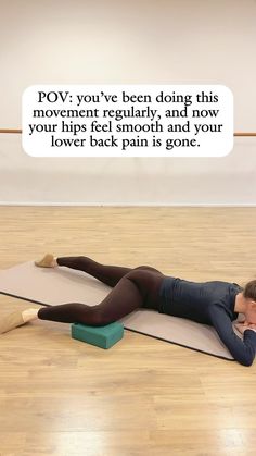 a woman laying on top of a yoga mat with her back to the camera and an empty speech bubble above her