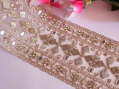 ♦ Feel Free to Message Me if Unable to Place your Order ♦ Indian Embroidered Clear Gold Wide Trim work lace is perfect for DIY sewing projects, designer cushion crafts, gifting and decorations. Width : Approx. 9cm wide Length : 2.16 Meter This beautiful lace trim is great for any sewing and craft projects. A perfect match for bridal dresses or any festive occasions. Our lace will add charm to your fabric, you can use this lace alone or add it with other laces to create a new unique design for, a Gold Machine Embroidered Fabric For Wedding, Gold Embellished Embroidered Fabric For Wedding, Traditional Machine Embroidered Fabric For Wedding, Festive Embellished Wedding Embroidered Fabric, Gold Embroidered Fabric With Motifs For Wedding, Gold Embroidered Wedding Fabric With Motifs, Dress Embellishments Diy, Wedding Dress Embellishments, Dress Embellishments