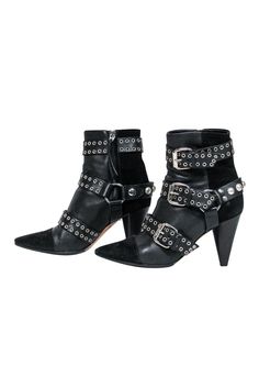 Unleash your inner rocker chick in these over-the-top booties from Isabel Marant. Buckles with grommets and studs adorn these edgy boots. Perfect for your next concert! Pair with distressed jeans and a leather jacket and you'll be sure to be invited on stage! Size 5.5 (FR 37) Leather upper w/ suede trim Buckled design w/ grommets and studs Interior side zipper closure Pointed toe Chunky heel Leather sole and footbed w/ very minor wear Heel 3.5" Edgy Boots, Isabel Marant Shoes, Rocker Chick, Buy Shoes Online, Buckle Shoes, Black Leather Heels, Madoka Magica, Chunky Heel, On Stage