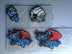 four pixellated images of sonic the hedgehogs in different positions on a gray surface