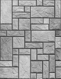 a black and white photo of a brick wall made out of different types of bricks