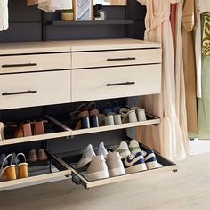 an organized closet with shoes and other items