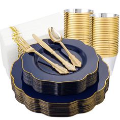 a blue plate with gold rimmed forks and spoons next to stacks of gold plates